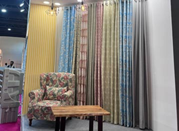 Industry professionals reviewing luxury curtain fabrics and home furnishing collections at Sunny Drape