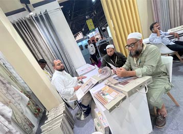 Industry professionals reviewing luxury curtain fabrics and home furnishing collections at Sunny Drape