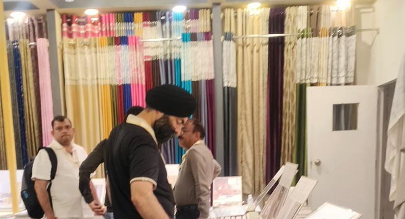 Home Decor Show 2026 visitors interacting with Sunny Drape fabric experts